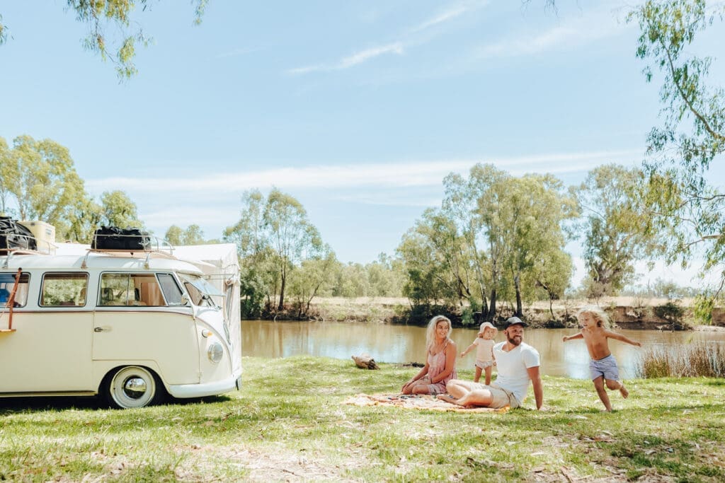 A family with a campervan camp on the Murray River at Richardsons Bend